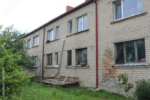 Crumbling Khrushchevka apartment building in Sece, Latvia photo