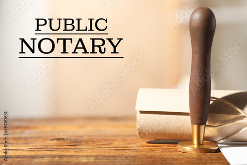 Fotografia Public notary. Document and stamp on wooden table, space for text
