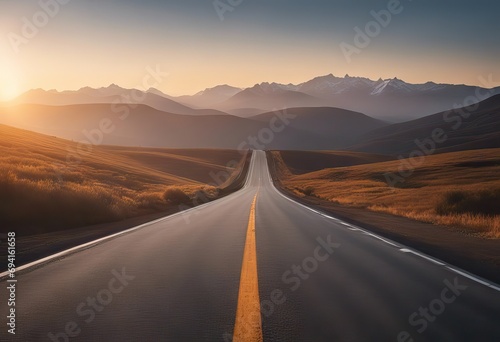 Asphalt road and mountains with foggy landscape at sunset stock photoRoad  Highway  Backgrounds  Horizon  Thoroughfare