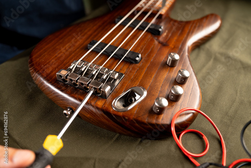 luthiers repairing electric bass