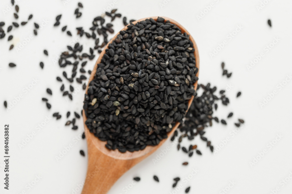 Black Sesame Seeds in Wooden Spoon Black Sesame Seeds in Wooden Spoon