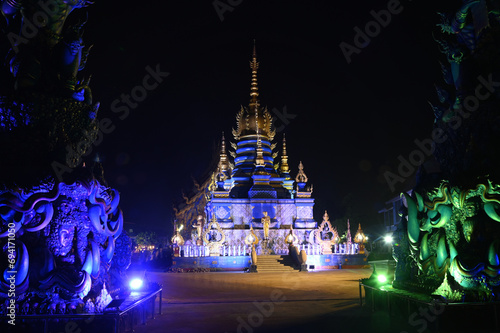 Night scene of Phra That Ket Kaew Chulamanee Containing the relics of the Lord Buddha It is contemporary art that is outstanding and beautiful, at Wat Rong Suea Ten temple. Located at Chiang Rai. photo