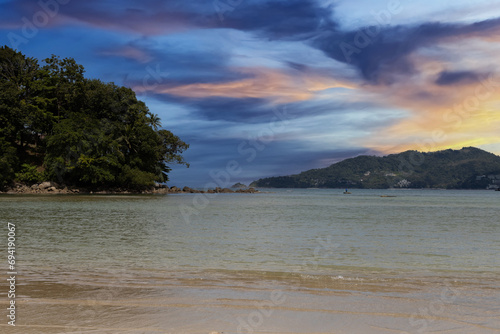 Patong Beach Phuket Thailand nice white sandy beach clear blue and turquoise waters and lovely blue skies with Palms tree