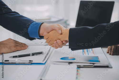 Business handshake for teamwork of business merger and acquisition,successful negotiate,hand shake,two businessman shake hand with partner to celebration partnership and business deal concept