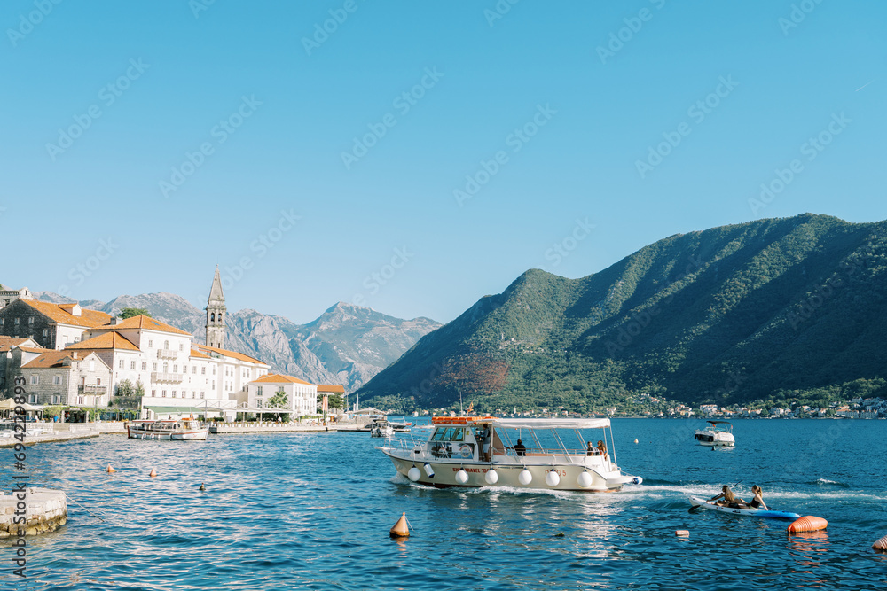 Excursion boat sails along the Bay of Kotor to the coast of Perast. Montenegro