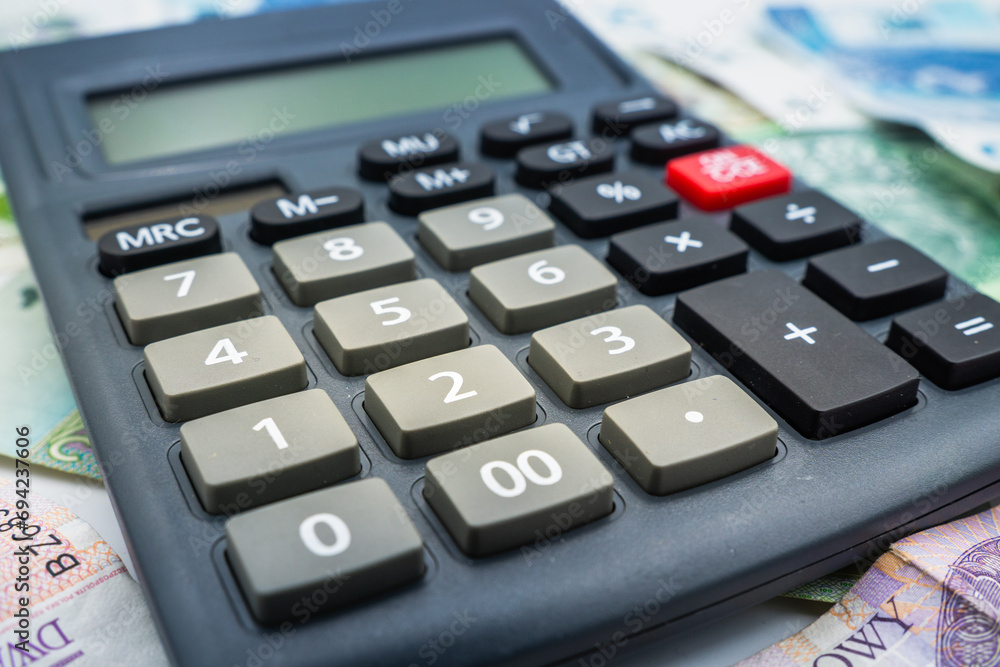Close up on a Calculator accounting concept Polish zloty banknote background currency Close up on a Calculator accounting concept Polish zloty banknote background currency