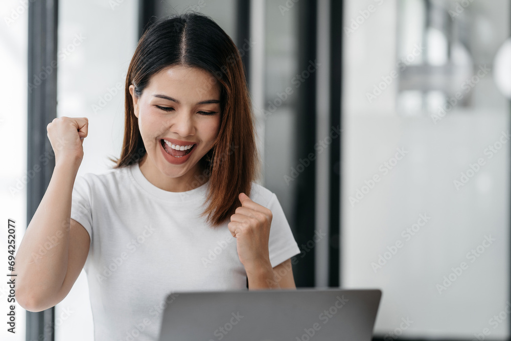 Asian business woman are excited business success with inspiration from their excellent financial results that are happy working in a modern office on a computer. Asian business woman are excited business success with inspiration from their excellent financial results that are happy working in a modern office on a computer.