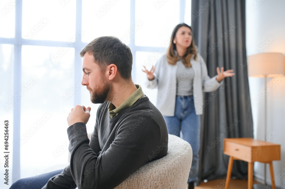 Family conflict, quarrel, misunderstanding. The woman shouts at her husband, in despair, crying Family conflict, quarrel, misunderstanding. The woman shouts at her husband, in despair, crying