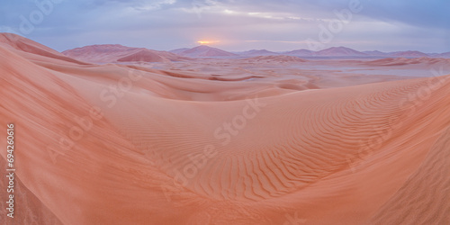 Panorama of pastel sand dunes with ripples in Empty Quarter desert in Oman photo