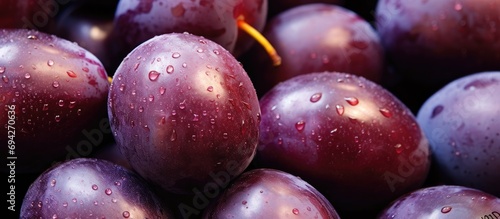 Ambarella(s) (jew plums) being sold on a market stall, close-up. photo