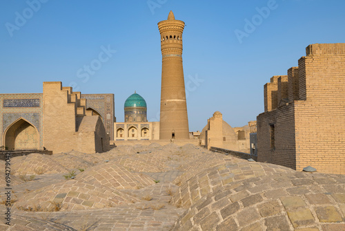 View of the medieval Kalon minaret from the roof of the Poi-Kpalyan mosque on a sunny day. Bukhara, Uzbekistan