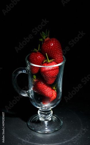 Red ripe strawberries on a black background  strawberries for dessert