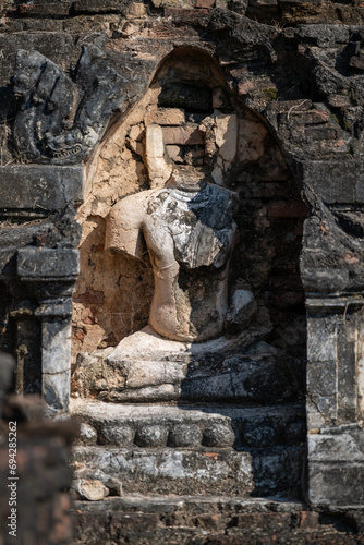 Wallpaper Mural damaged buddha statue in Wat Chetuphon at Sukhothai Historical Park. Torontodigital.ca