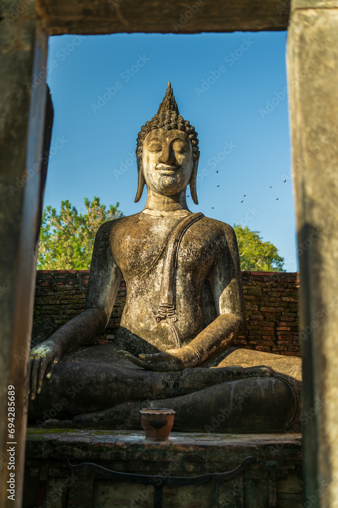 The huge sitting Buddha in Wat Si Chum at Sukhothai, Thailand. 