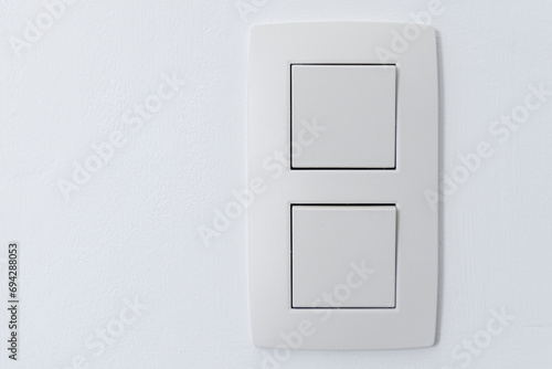 Close up of wall double light switch. Place for text