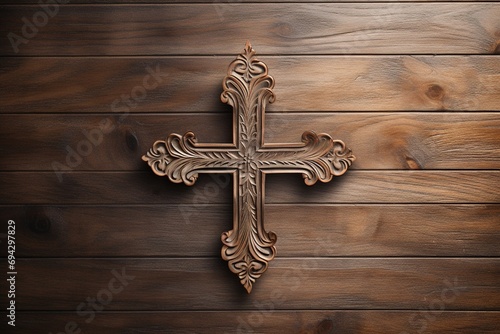 Wooden christian cross on a wooden background.Christian religion concept.