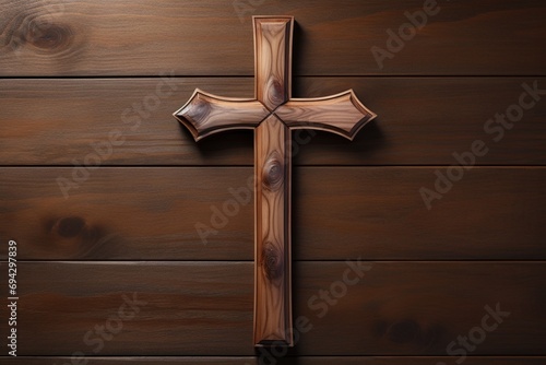Wooden christian cross on a wooden background.Christian religion concept.
