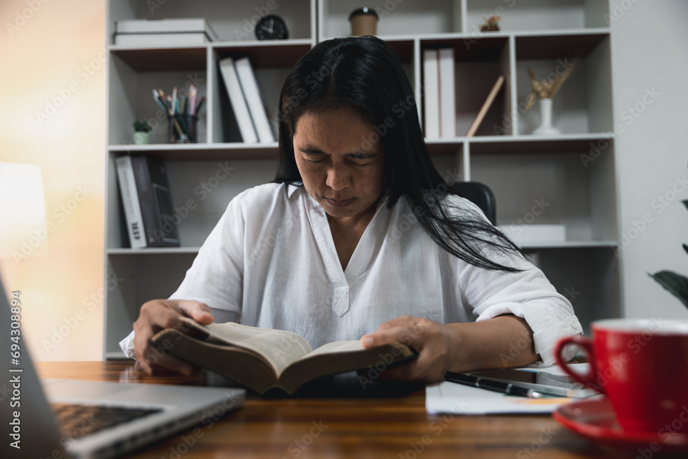 Businesswoman Praying with Eyes Closed. Businesswoman with her hands folded waiting for good news sitting at workplace at the table in the office. Hands folded in prayer gesture beg about something. Businesswoman Praying with Eyes Closed. Businesswoman with her hands folded waiting for good news sitting at workplace at the table in the office. Hands folded in prayer gesture beg about something.