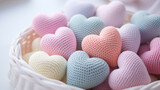 Colorful knitted hearts in the basket. Valentine's Day or Mother's Day concept