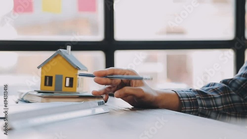 Hands of architect or engineer working on blueprint meeting for project working with partner on model building and engineering tools in working site, Construction and structure concept. photo