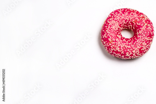 Sweet pink donut on white background, pink dessert