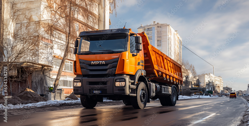 Truck On The Road Profile Photo Of An Orange Kamaz Dump Truck In The