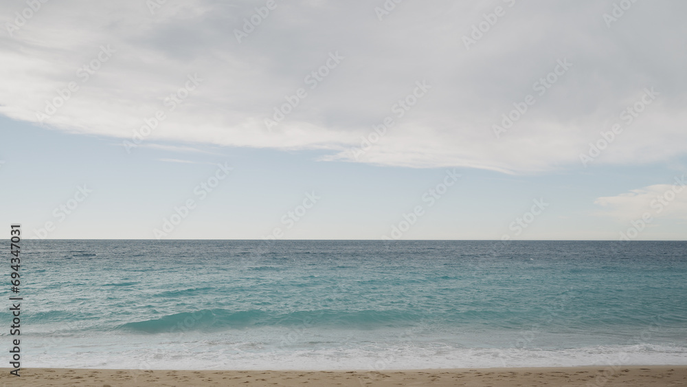 Clear blue waves with strong wind on a sandy empty beach in Cannes in spring