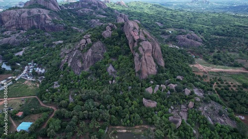 Cinematic drone shot of beautiful big rock mountain or Ramadevara Betta or Sholay hills photo