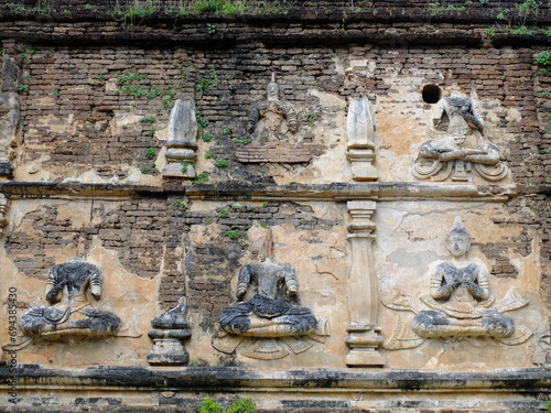 Ancient Northen Thai art on Jedyod Royal Temple pagoda, Chiang Mai, Thailand. photo