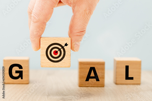 Obraz na płótnie Goal symbol A raised dice with a target and an arrow in the middle, forming the word