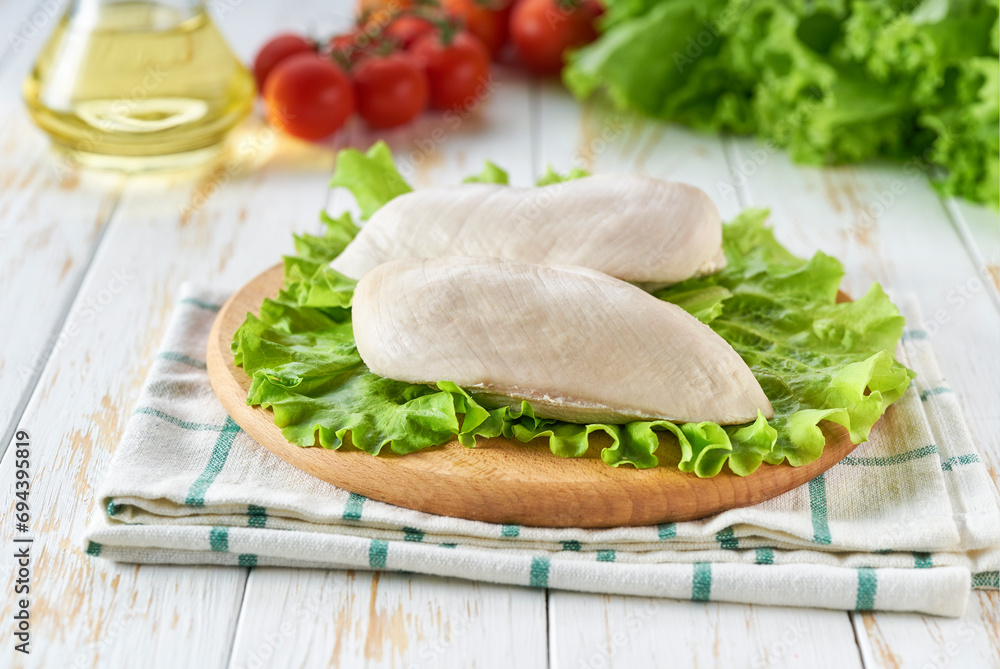 Boiled chicken filled with spices and herbs on a wooden table. Boiled chicken filled with spices and herbs on a wooden table.