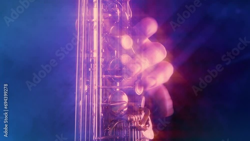Saxophonist Plays On Stage With Glows And Flares
 photo
