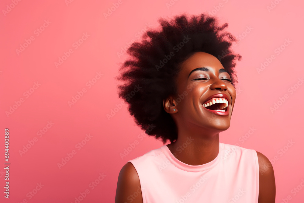 Close-up portrait of happy girl with big smile and afro hairstyle. Smiling dark skinned beautiful woman. Pink background. Close-up portrait of happy girl with big smile and afro hairstyle. Smiling dark skinned beautiful woman. Pink background.