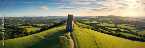 Aerial view of Glastonbury Tor near Glastonbury in the English county of Somerset, topped by the roofless St Michael's Tower, UK. Ai Generative.