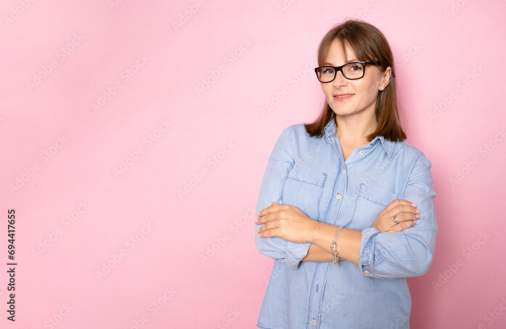 Photo of attractive charming business lady smiling hold arms hands crossed good mood self-confident successful worker person wear blue shirt isolated pink color background Photo of attractive charming business lady smiling hold arms hands crossed good mood self-confident successful worker person wear blue shirt isolated pink color background
