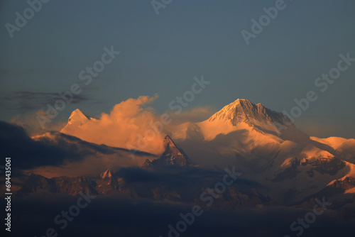 annapurna south located in Annapurna mountain range in Nepal during afterglow photo