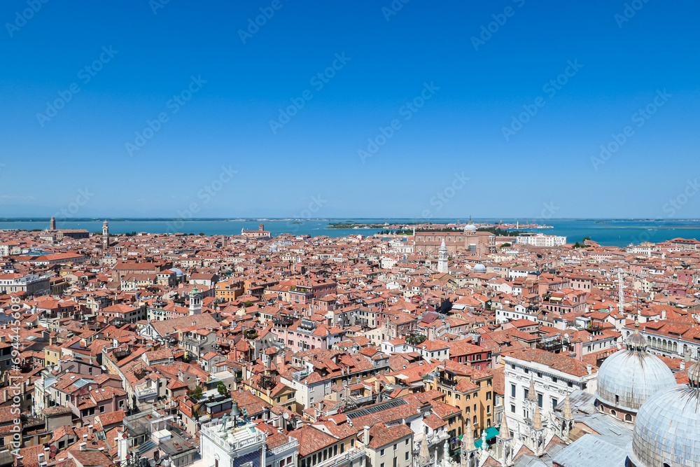 Aerial view from St Mark bell tower Campanile of the old town of Venice, Veneto, Italy, Europe. Looking at Piazza San Marco and Doge's palace. UNESCO World Heritage Site. Urban tourism in summer