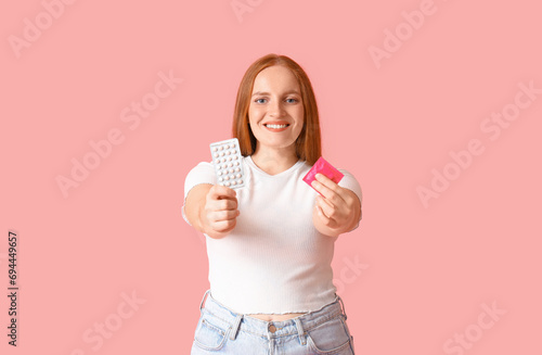 Young woman with condom and...