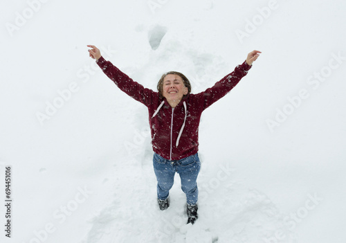 girl playing with snow