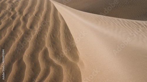 Beautiful serene sand dunes at Lac Naila. Where the Sahara desert meets the Atlantic Ocean, National Park Kheniffis, Morocco. 4k natural landscape background footage.