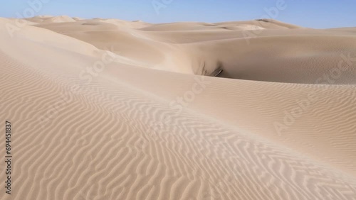Beautiful serene sand dunes of Lac Naila. Where the Sahara desert meets the Atlantic Ocean, National Park Kheniffis, Morocco. 4k natural landscape background footage. 