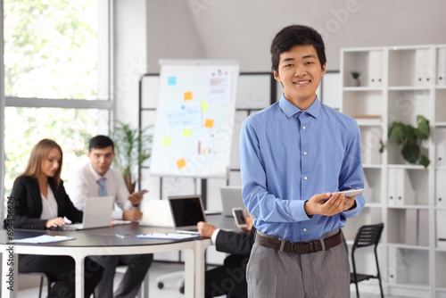 Young Asian businessman wit...
