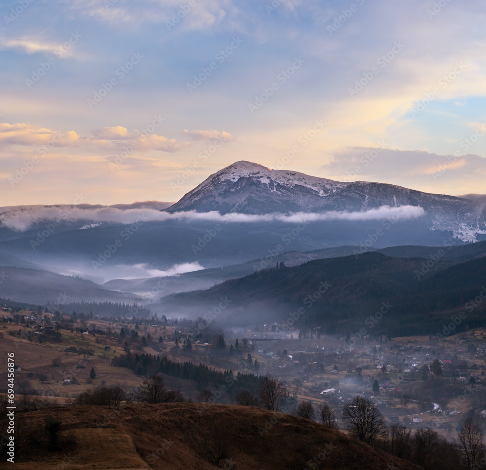 Obraz premium Picturesque morning above late autumn mountain countryside. Ukraine, Carpathian Mountains, Petros top in far. Peaceful traveling, seasonal, nature and countryside beauty concept scene.