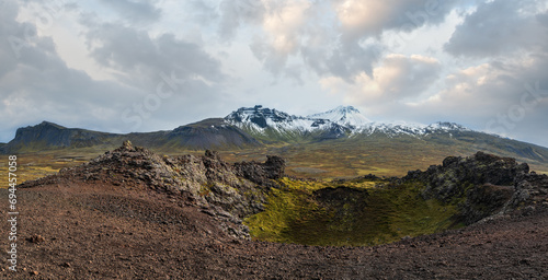 Spectacular volcanic view from Saxholl Crater, Snaefellsnes peninsula, West Iceland. Snaefellsjokull snowy volcano top in far. © wildman