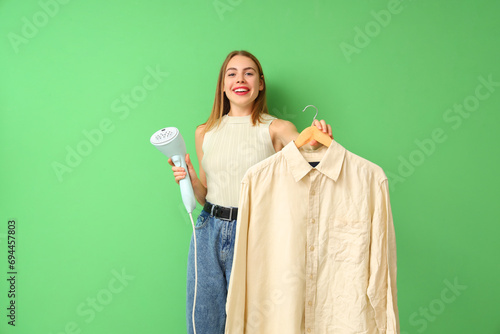 Young woman with steamer an...