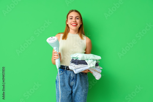 Young woman with steamer an...
