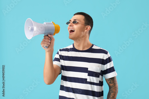 Young man shouting into meg...