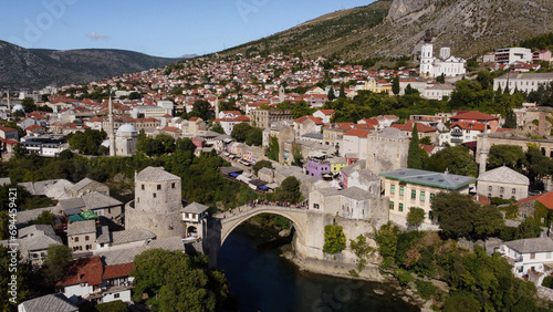 Timeless Beauty: Mostar's Old Bridge Overlooking the Neretva River. Historic Town From the Balkans. photo