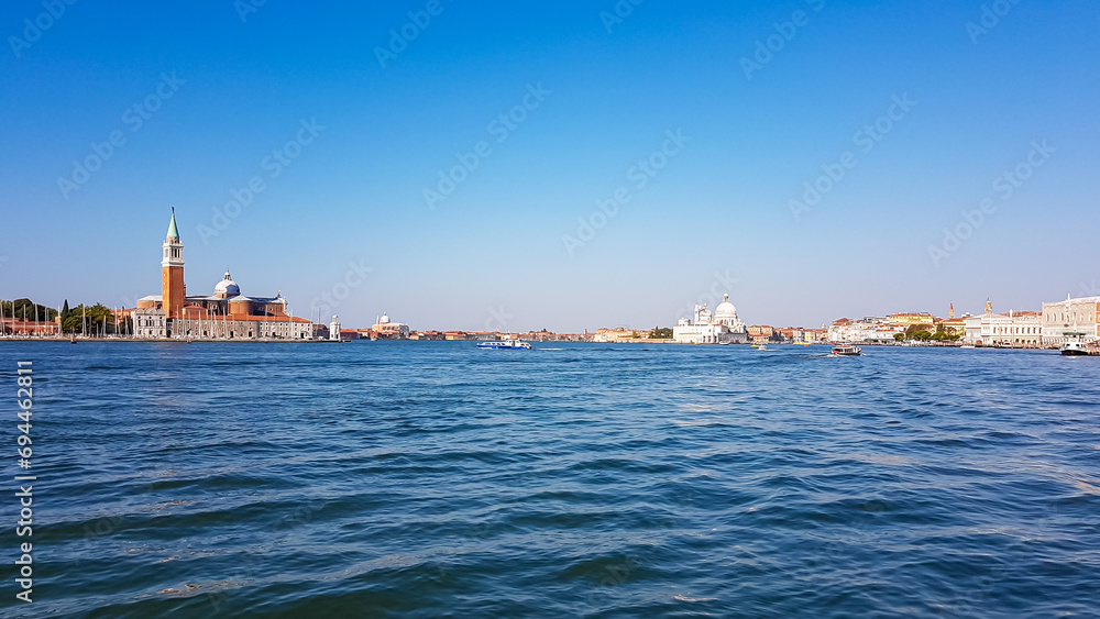 Scenic  view of Campanile Bell Tower and church on the Island of San Giorgio Maggiore, Venice, Veneto, Northern Italy, Europe. Perspective from San Mark Square. Soft light in tranquil atmosphere