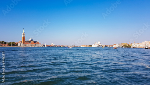 Scenic view of Campanile Bell Tower and church on the Island of San Giorgio Maggiore, Venice, Veneto, Northern Italy, Europe. Perspective from San Mark Square. Soft light in tranquil atmosphere